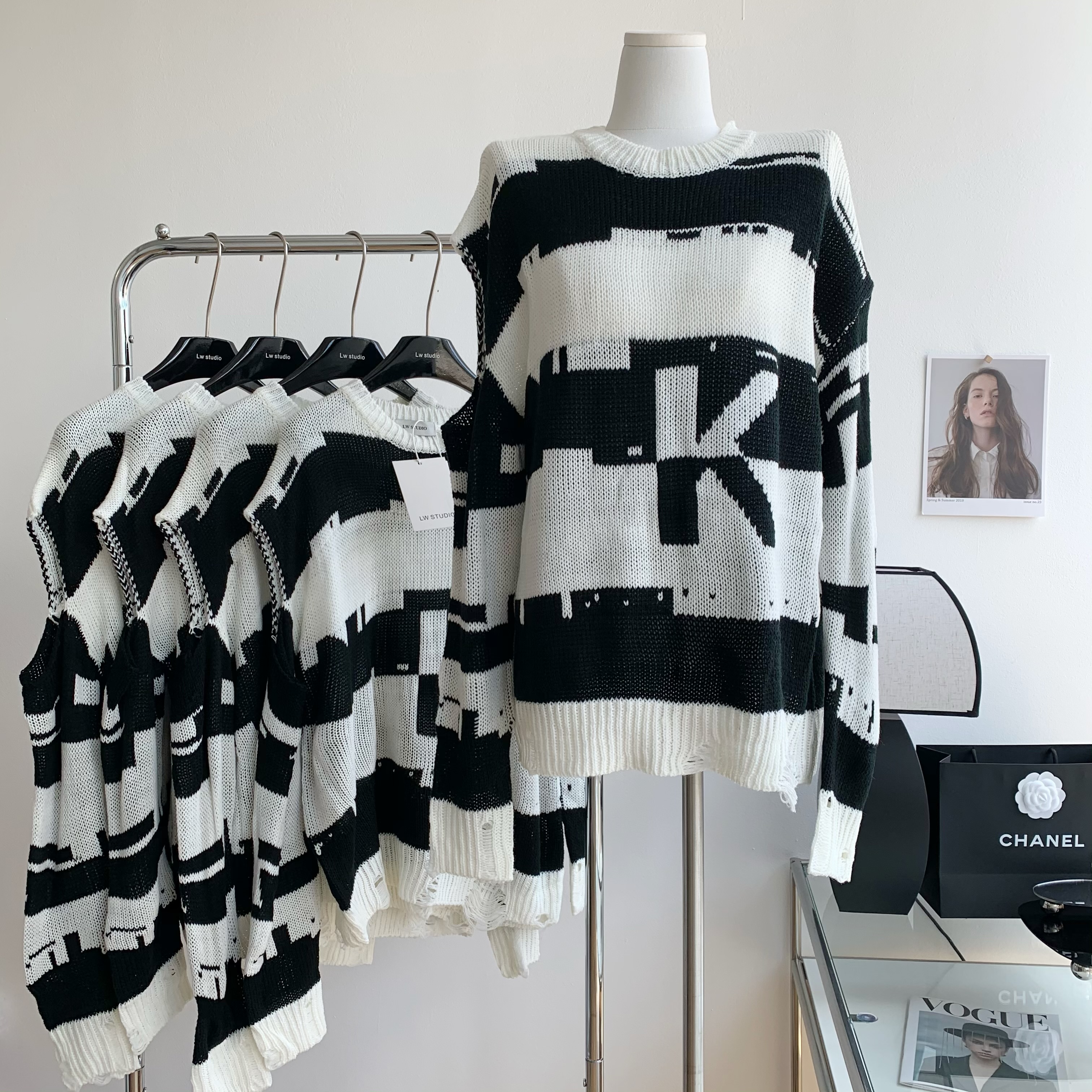 2022 spring new black and white striped hole design sense of minority chic milk Department christmas wear sweater women