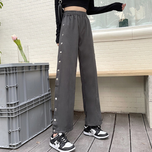 Real time casual pants female Spice Girl American sports pants street side button pants female design sense of minority high street trend