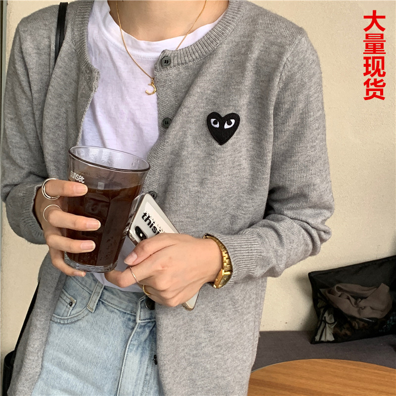 2021 spring and Autumn New Korean peach heart knitted cardigan women's long sleeve short slim bottomed sweater small coat