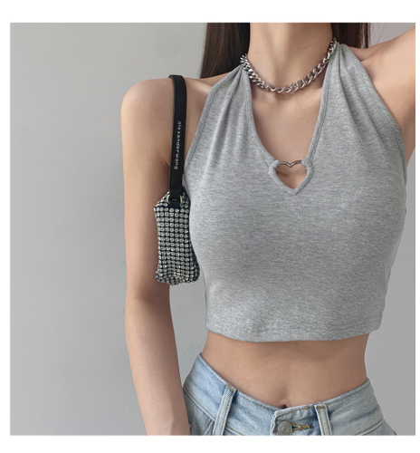 Cool SA Spice Girl Metal love hollow out hanging neck suspender design, wearing sleeveless top and exposed navel short vest