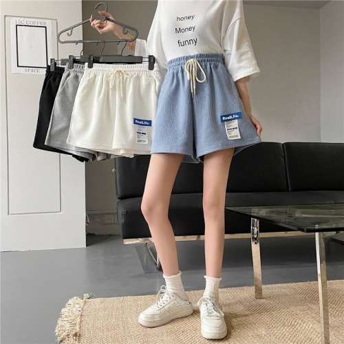 Real shot 2022 summer label waffle casual shorts women's loose and versatile elastic high waist and versatile wide leg hot pants
