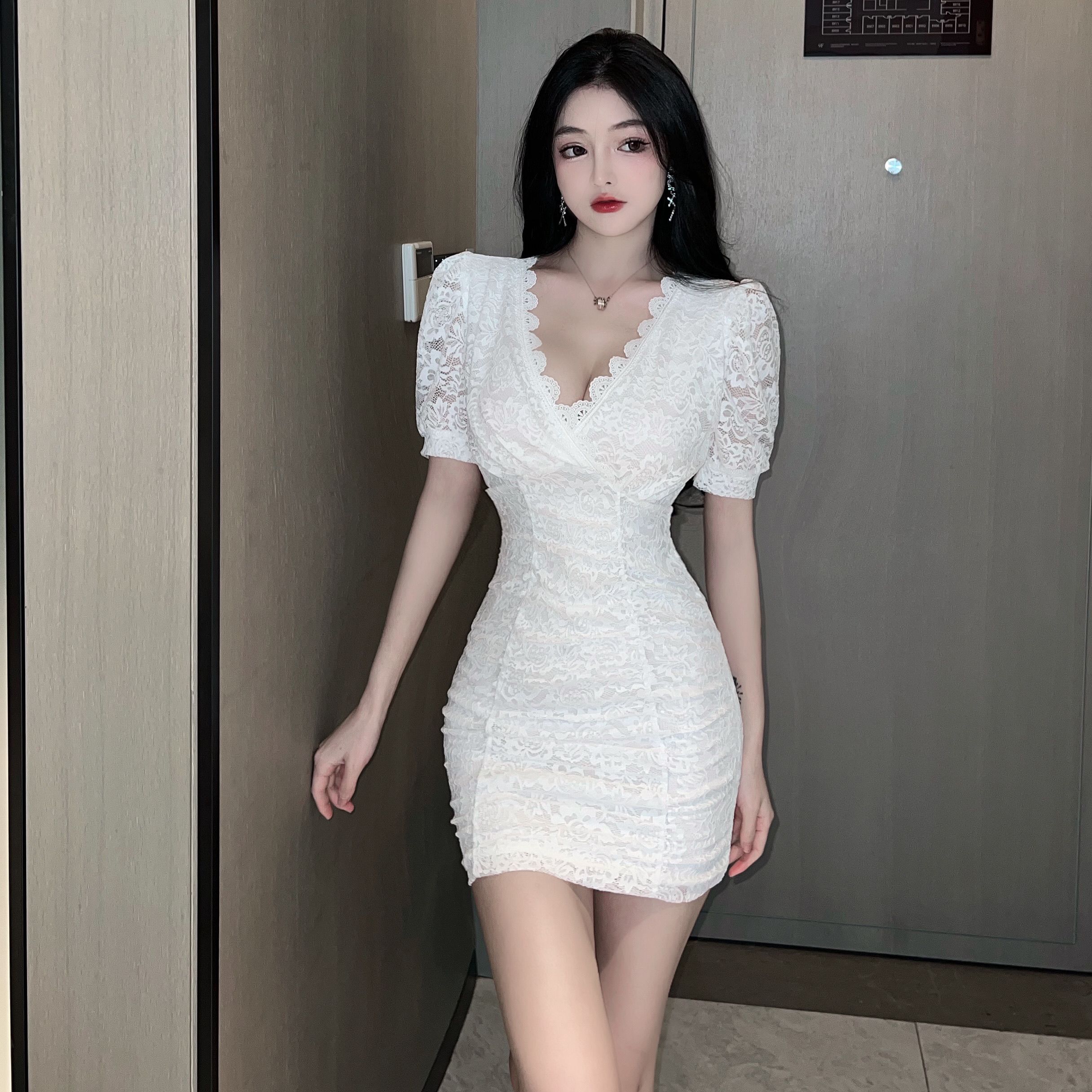 Real shot sexy nightclub celebrity style V-neck lace stitched pleated buttock dress