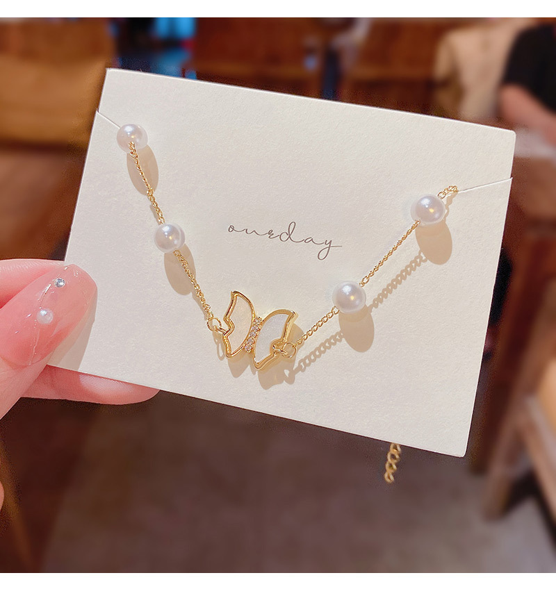 Real shot ins style versatile pearl fritillary Bow Bracelet Female Minority design sense hand string hand ornament