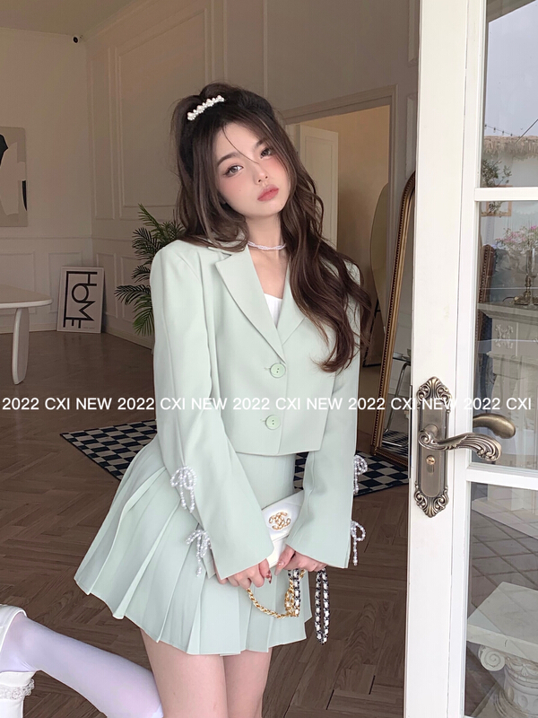 Early spring! [CXI] design sense crystal bow knot slit sleeve short coat + pleated skirt two piece suit a9013# jhy