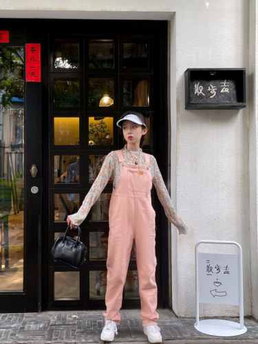 Real shooting real price ~ pink overalls autumn women's new design sense of small milk net red small jeans