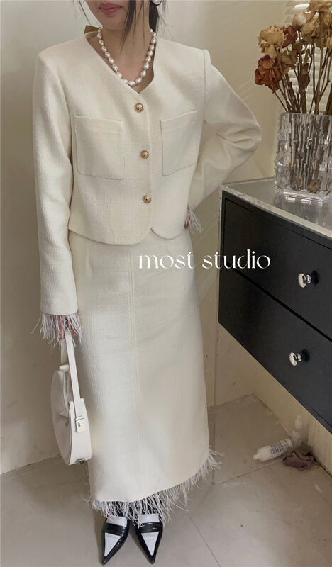 Autumn is new! [MOST] V-neck fashion short coat + fringed little woman skirt suit 97531# ZJY