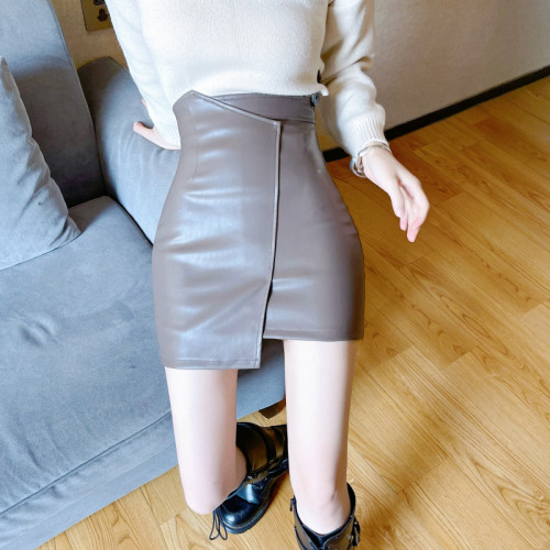 Real shot fashion design irregular high waist slim hip skirt autumn and winter leather skirt