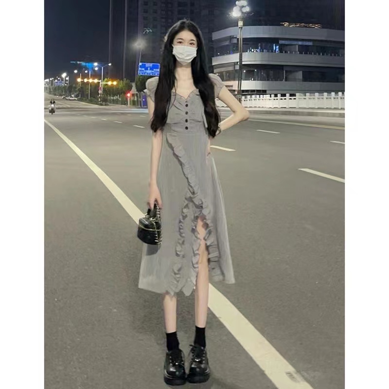College style temperament girl dress 2023 summer new design sense wood ear side slit mid-length skirt