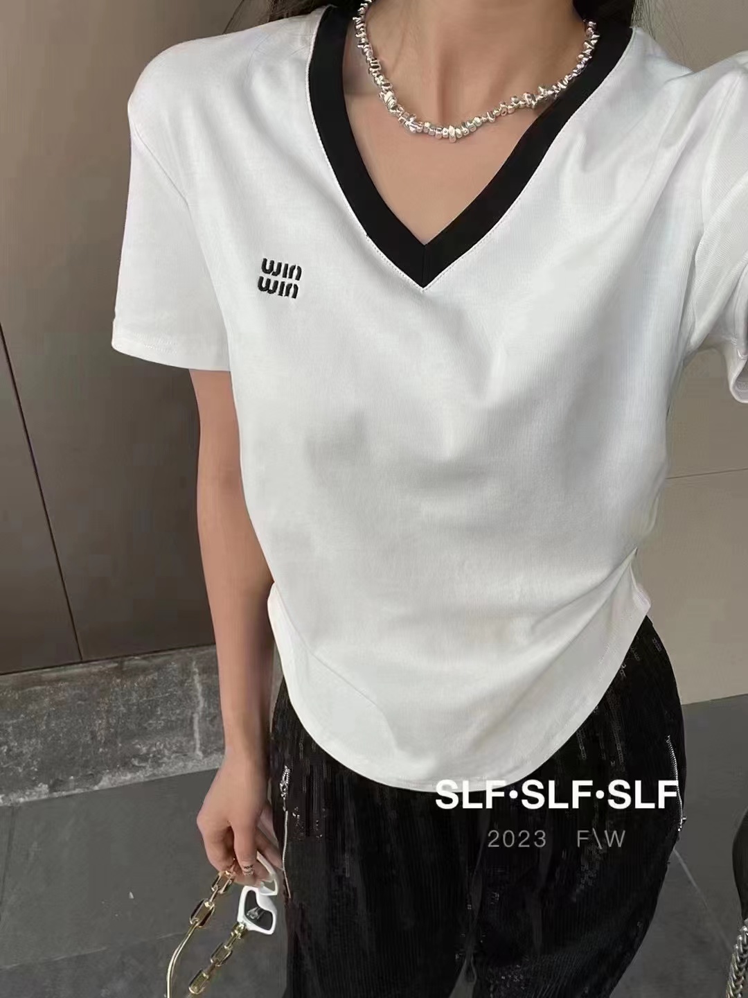 Korea 2023 summer new fashion all-match waist slimming age reduction color matching irregular V-neck T-shirt women