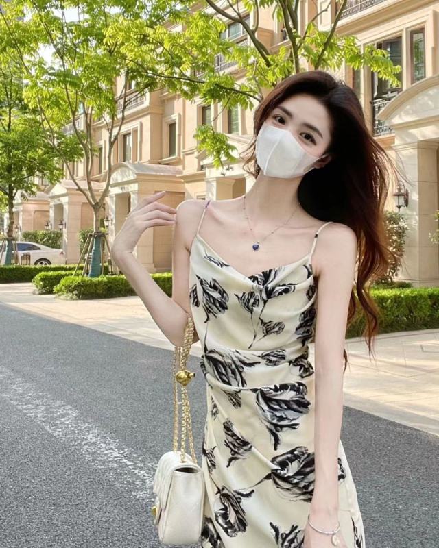 Beach seaside holiday floral suspender dress female summer 2023 new pure desire sexy waist long skirt