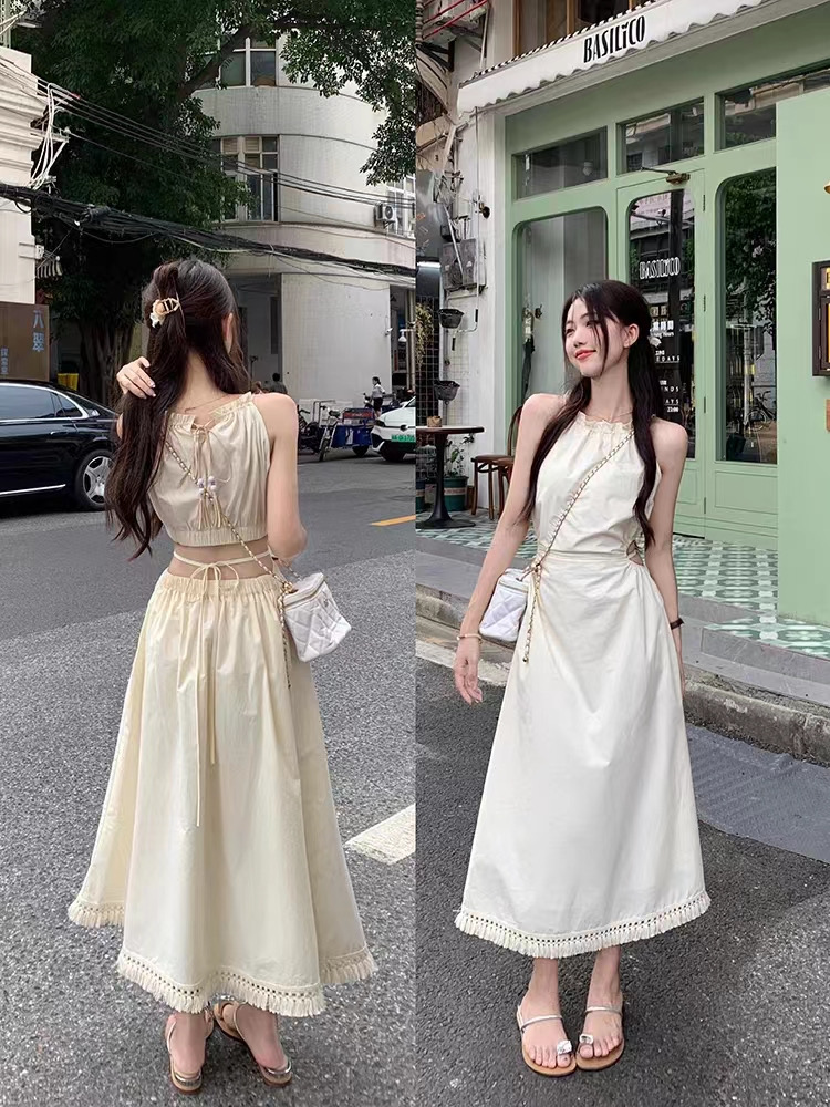 Seaside niche design sense hollow out waist hanging neck suspender dress women's summer waist slim tassel long skirt
