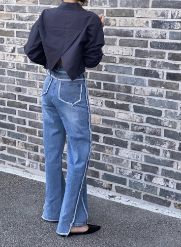 Raw slit paneled flared jeans