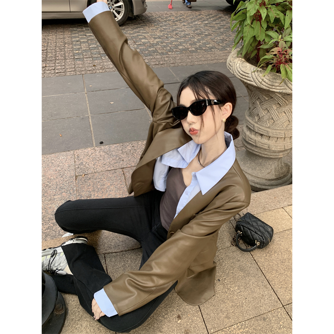 Tmall quality 2023 autumn design lapel fake two-piece leather jacket for women