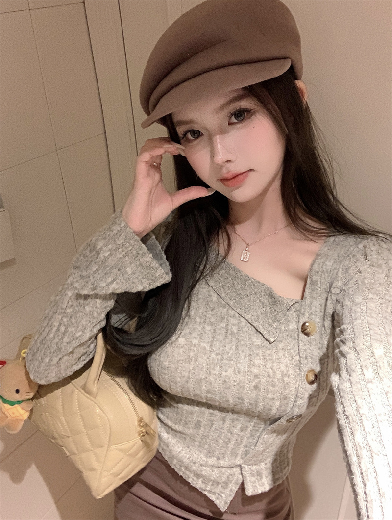 實拍~長袖針織女溫柔風修身不規則斜襟單排扣上衣潮