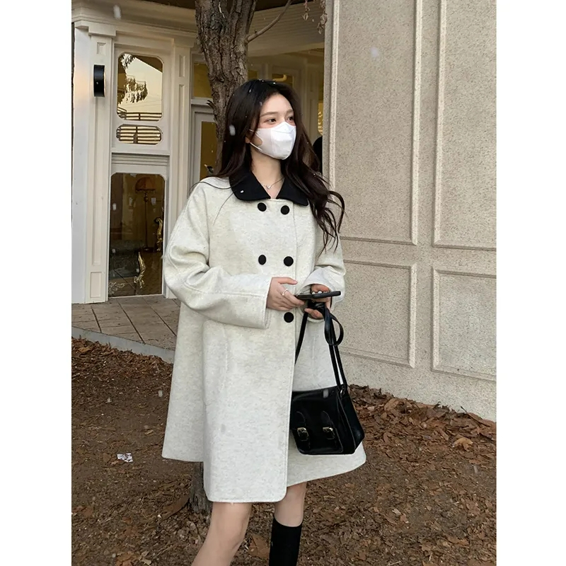 燕麥色大衣女秋冬2023新款法式氣質設計感雙排扣翻領長袖毛呢外套