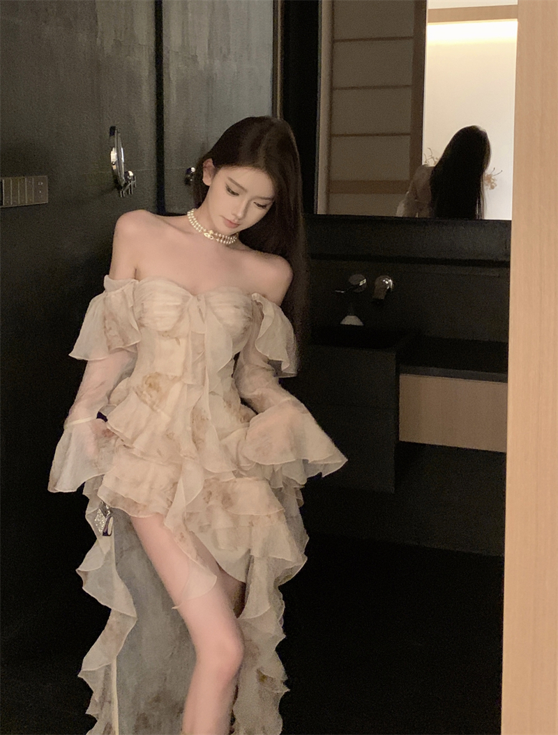 Actual shot of long-sleeved, romantic, beautiful, textured, ruffled, irregular and elegant dress.