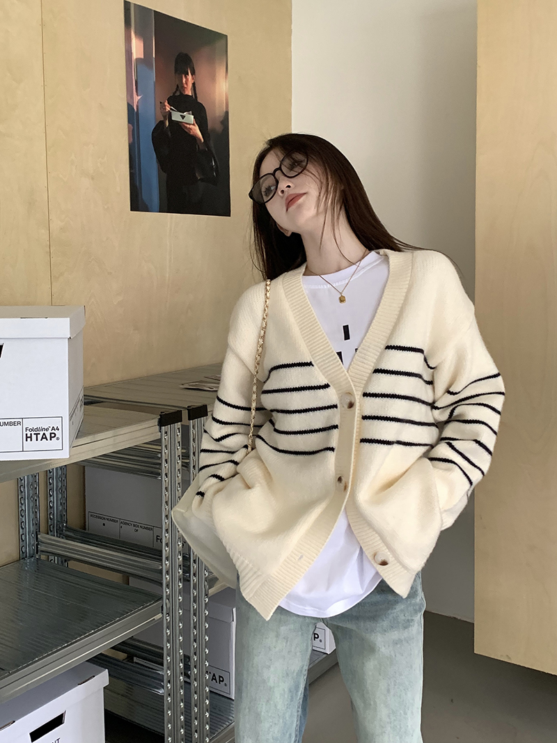 Real shot of classic casual striped knitted cardigan, loose, slim and versatile top