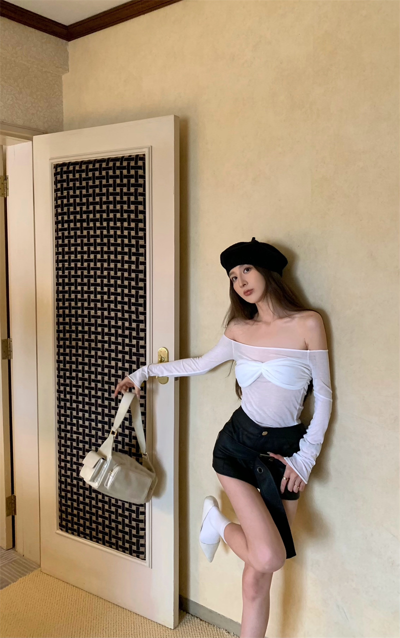 Real shot of a sexy hot girl wearing a stylish one-shoulder top + half-length leather skirt