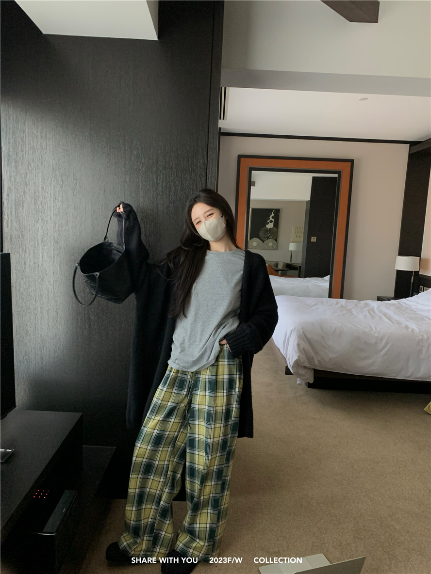 Actual shot of loose slimming plaid trousers and long sweater and cardigan jacket suit