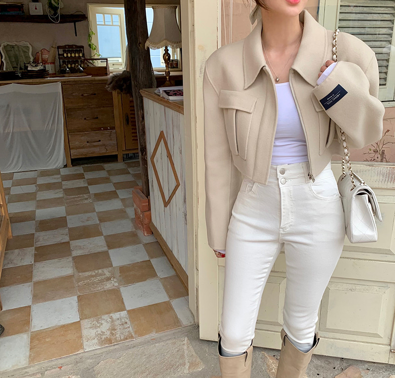 Short woolen jacket with flap pockets and zippers