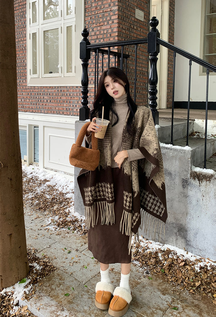 Actual shot of autumn and winter warm shawl blanket and knitted cardigan cloak