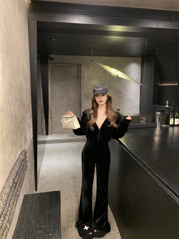 Actual shot of slim black velvet suit for women, fashionable hooded short cardigan and flared trousers