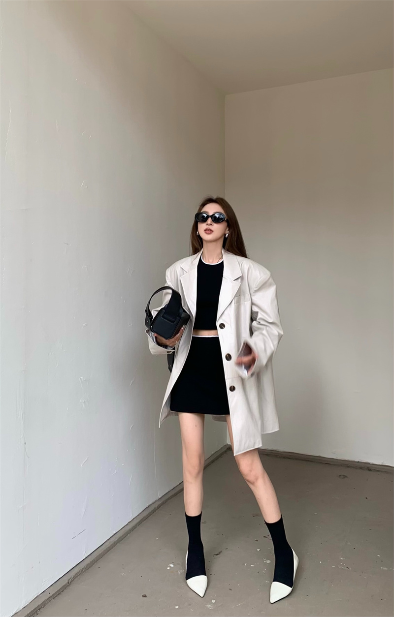 Real shot of street retro leather jacket with pocket design, lazy and fashionable blazer + skirt suit