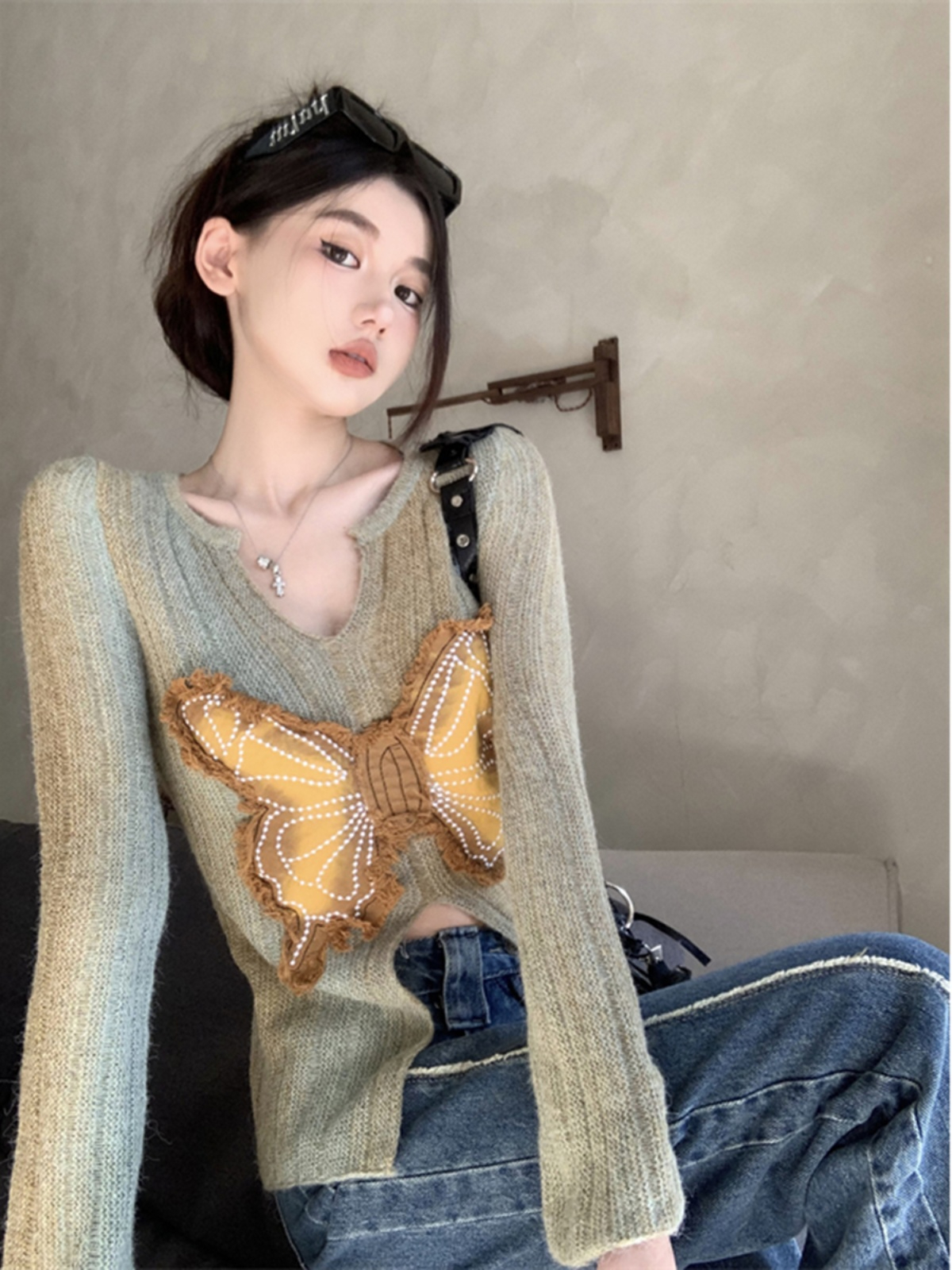 辣妹開叉修身長袖針織衫女秋季新款蝴蝶設計感顯瘦打底毛衣
