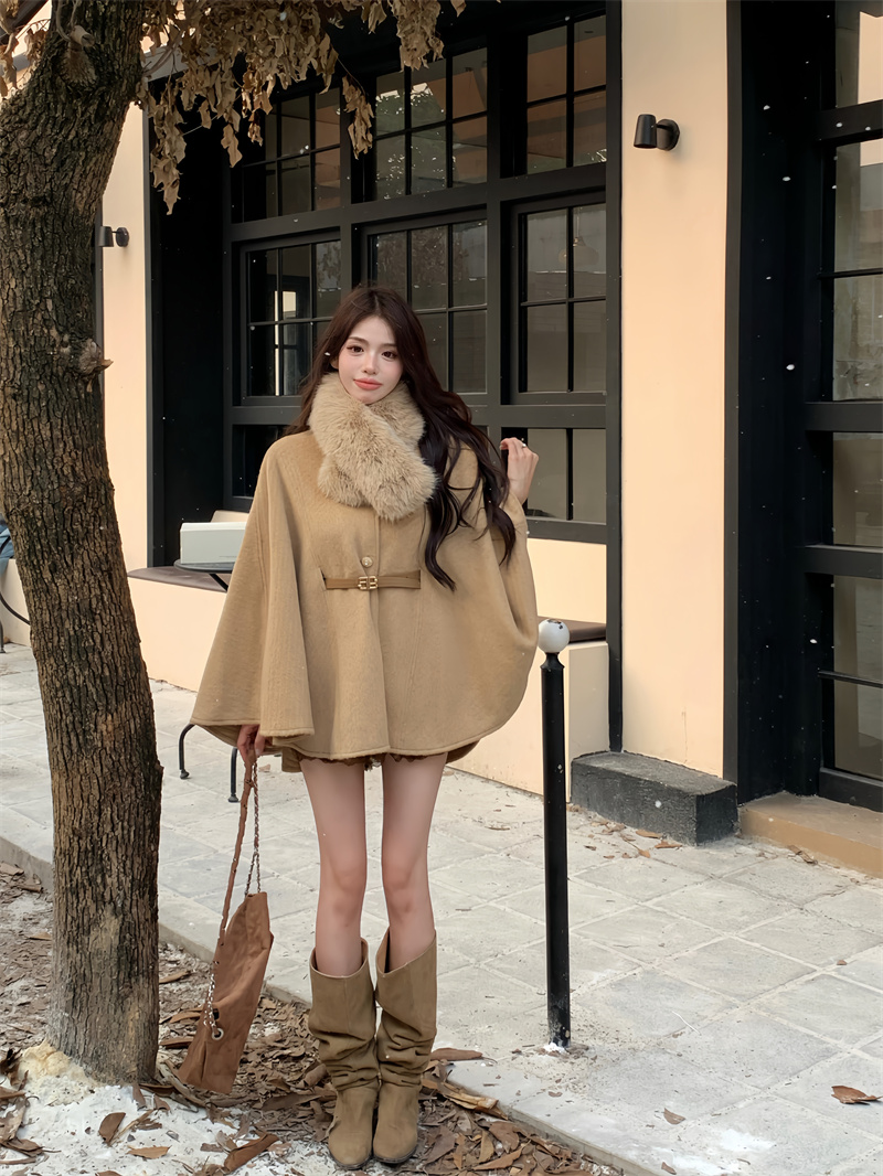 Actual shot of ladylike design with fur collar and belt, loose cape and shawl coat