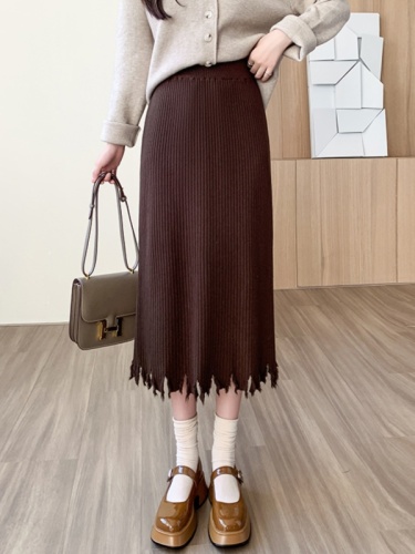 Black knitted skirt for women, autumn and winter, slimming, high waisted, tassel design, hip-hugging skirt, mid-length a-line skirt