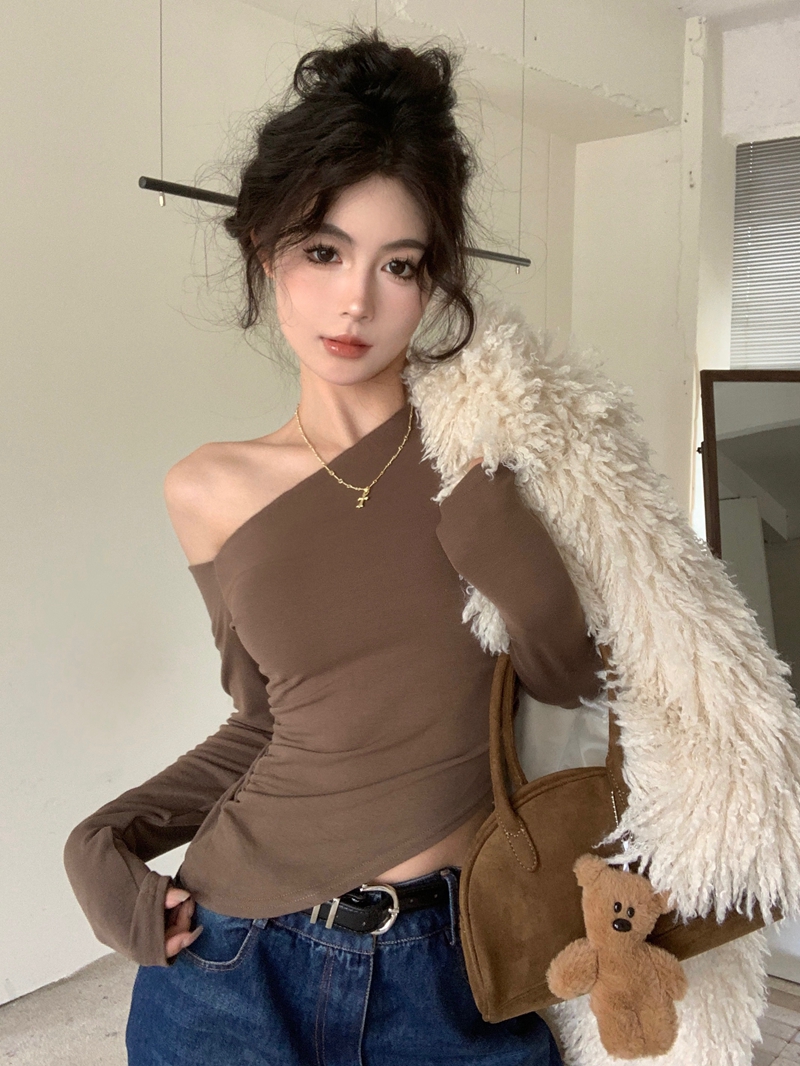 實拍純欲性感辣妹風不規則黑色露肩長袖T恤修身顯瘦斜肩上衣