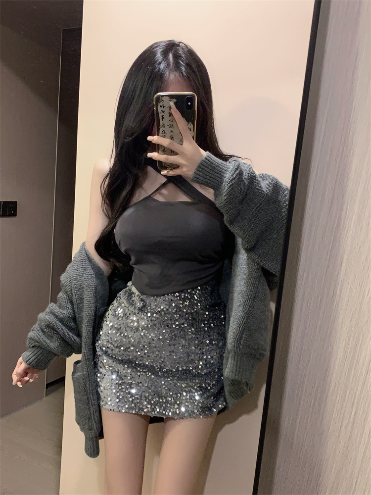 Actual shot of long-sleeved warm sweater jacket with cross halter straps and sequined high-waisted skirt