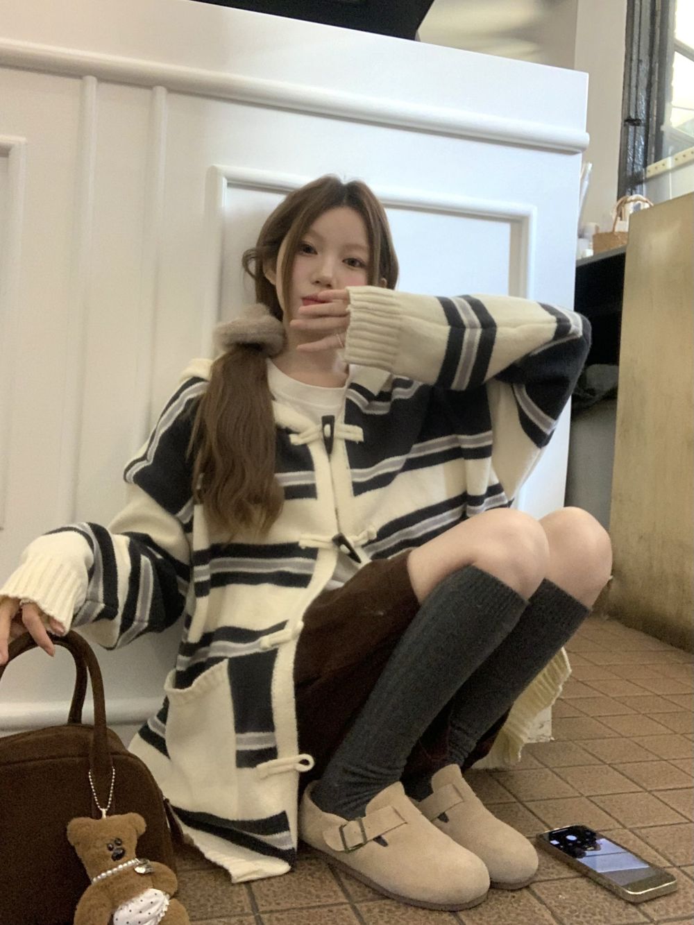 Actual shot of three-label striped hooded horn button lazy sweater jacket for women