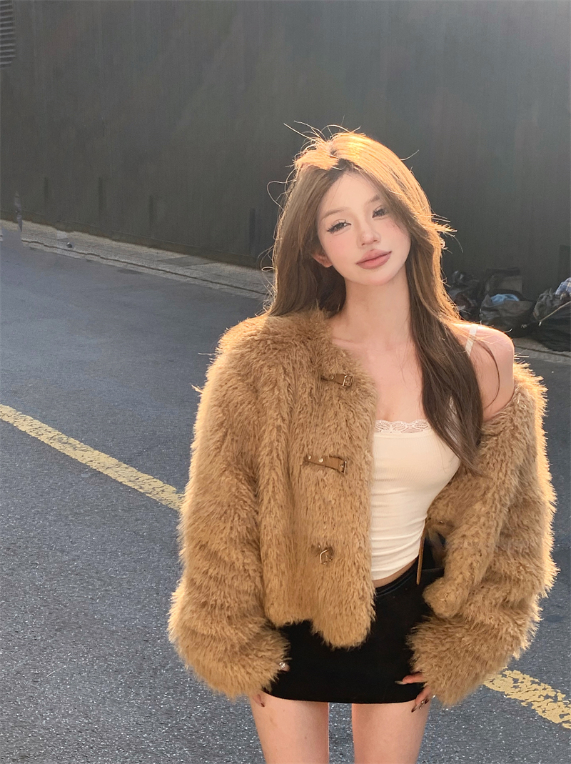 Actual shot of elegant and fashionable furry short coat and leather buttoned top