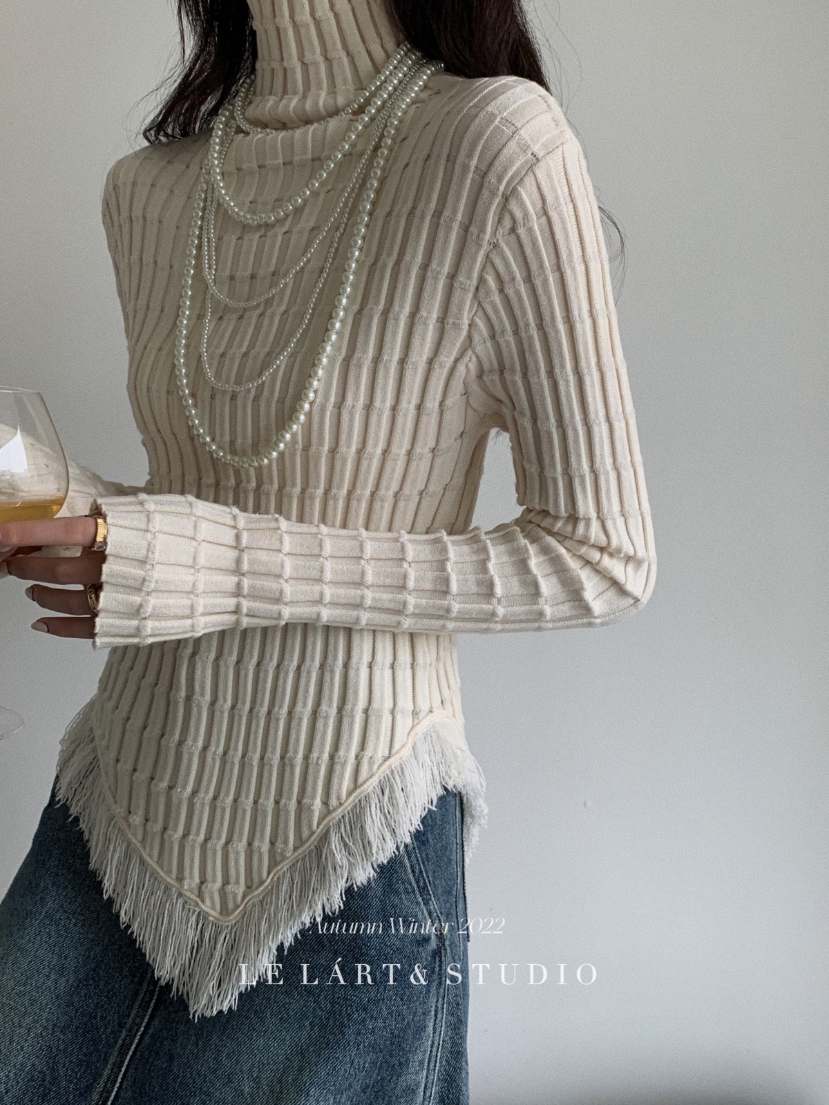 Design sense French pure lust style tassel high collar irregular slim knitted sweater for women winter