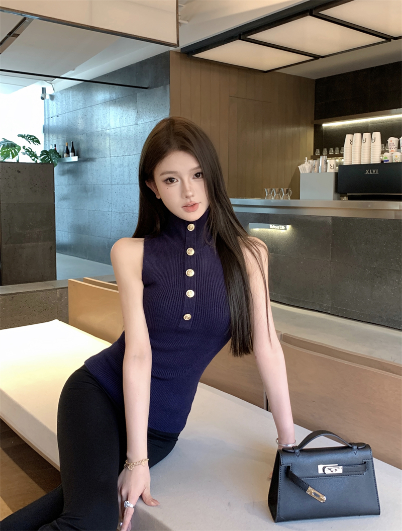 Actual shot of a white turtleneck sleeveless wool knitted vest top with a sense of design