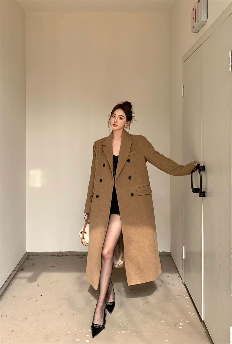 Actual shot of a slim fit and slim woolen suit with a retro style and a long coat