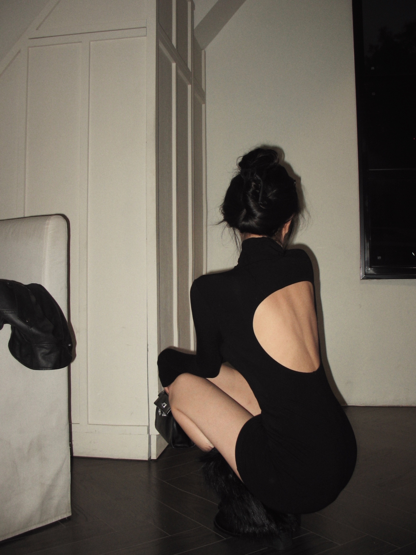 Real shot of black high-necked long-sleeved sexy hottie dress with backless slim fit and hip-hugging short skirt