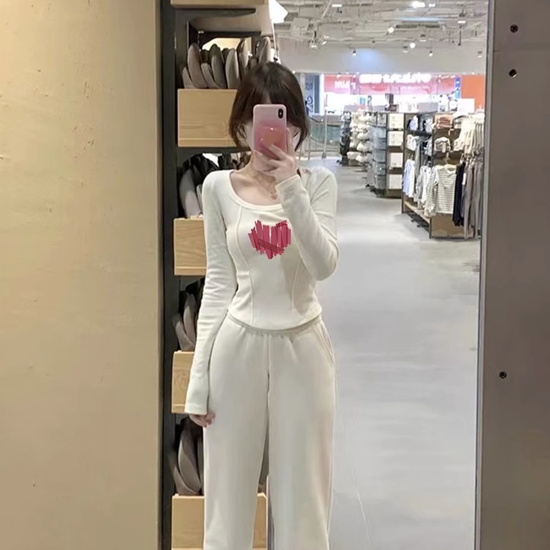 秋季修身弧形下擺長袖t恤女打底衫不規則別致設計感小眾上衣