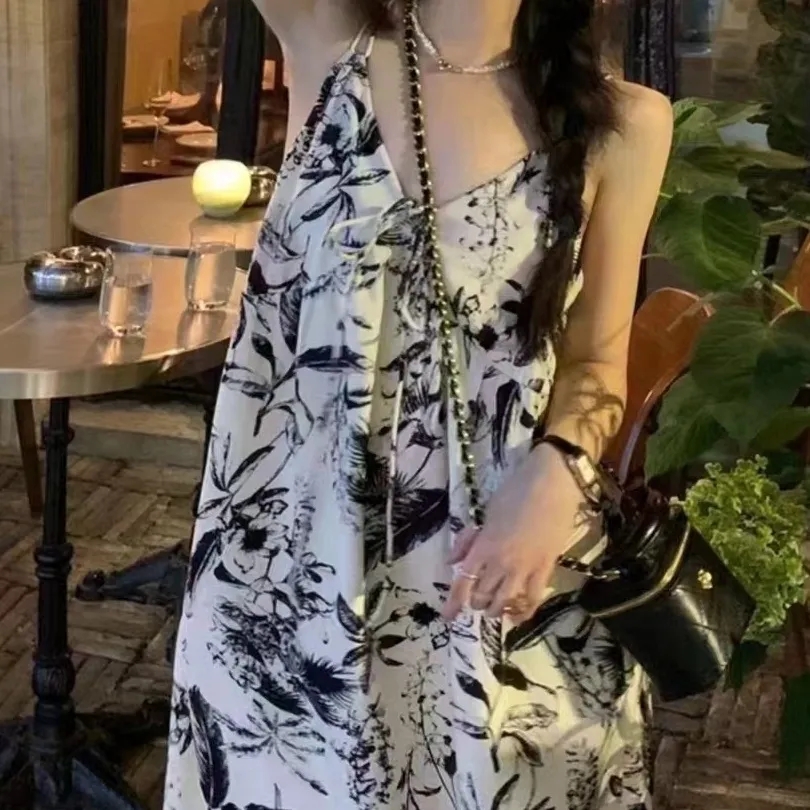 水墨v領吊帶連衣裙女春夏法式寬鬆慵懶休閒度假碎花長裙
