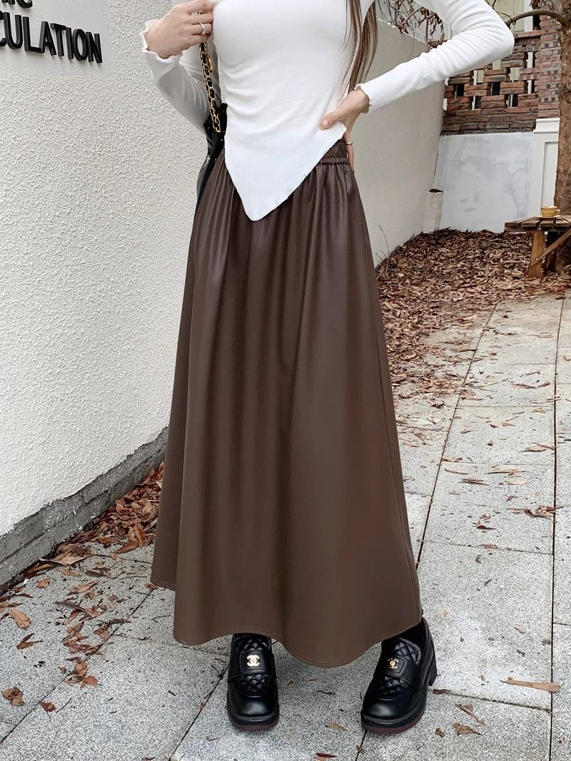Autumn and winter 2023 new American style Hong Kong style hot girl high-end PU leather skirt women's high waist slimming A-line umbrella skirt