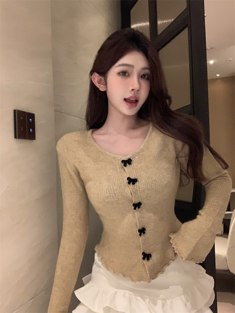 Actual shot of designer earring sweater with bow button top and slim bottoming shirt