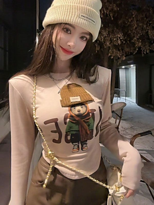 Cartoon printed long-sleeved round neck chic T-shirt for women in autumn and winter American hottie curved hem slim short top