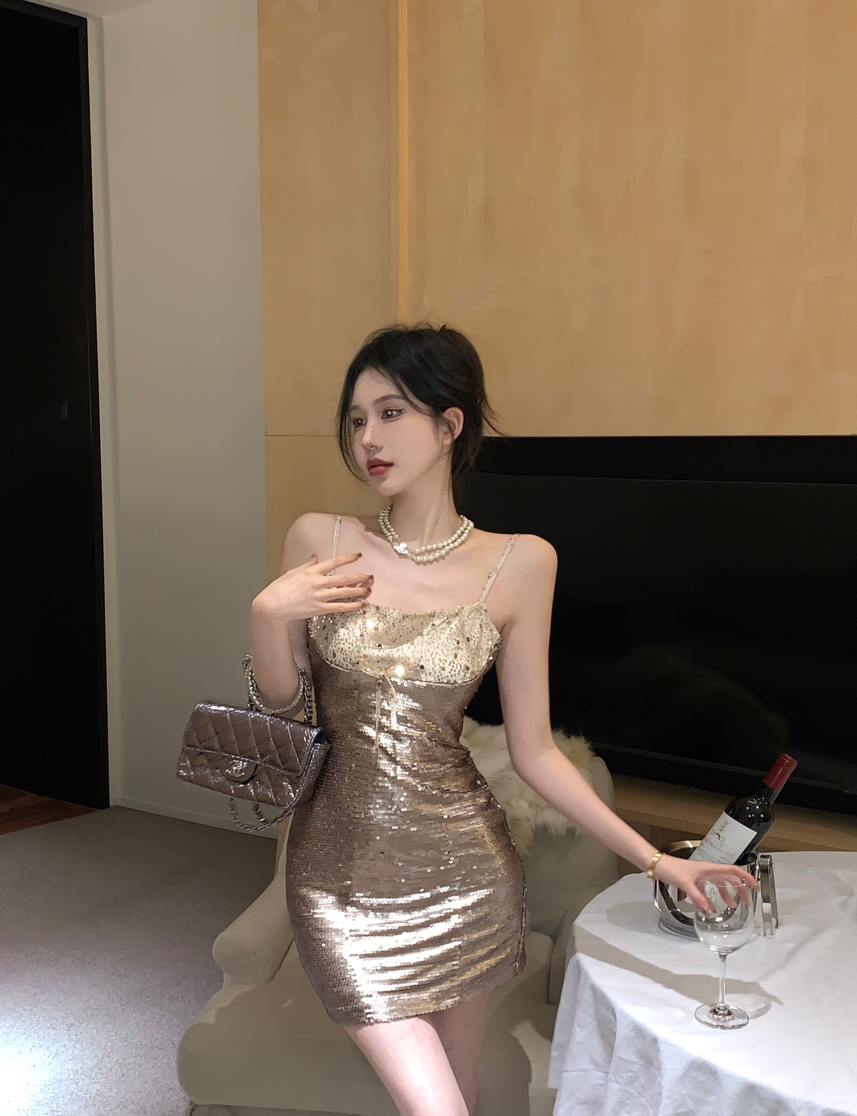 Actual shot of a glamorous design slim dress with a sequined skirt underneath in winter