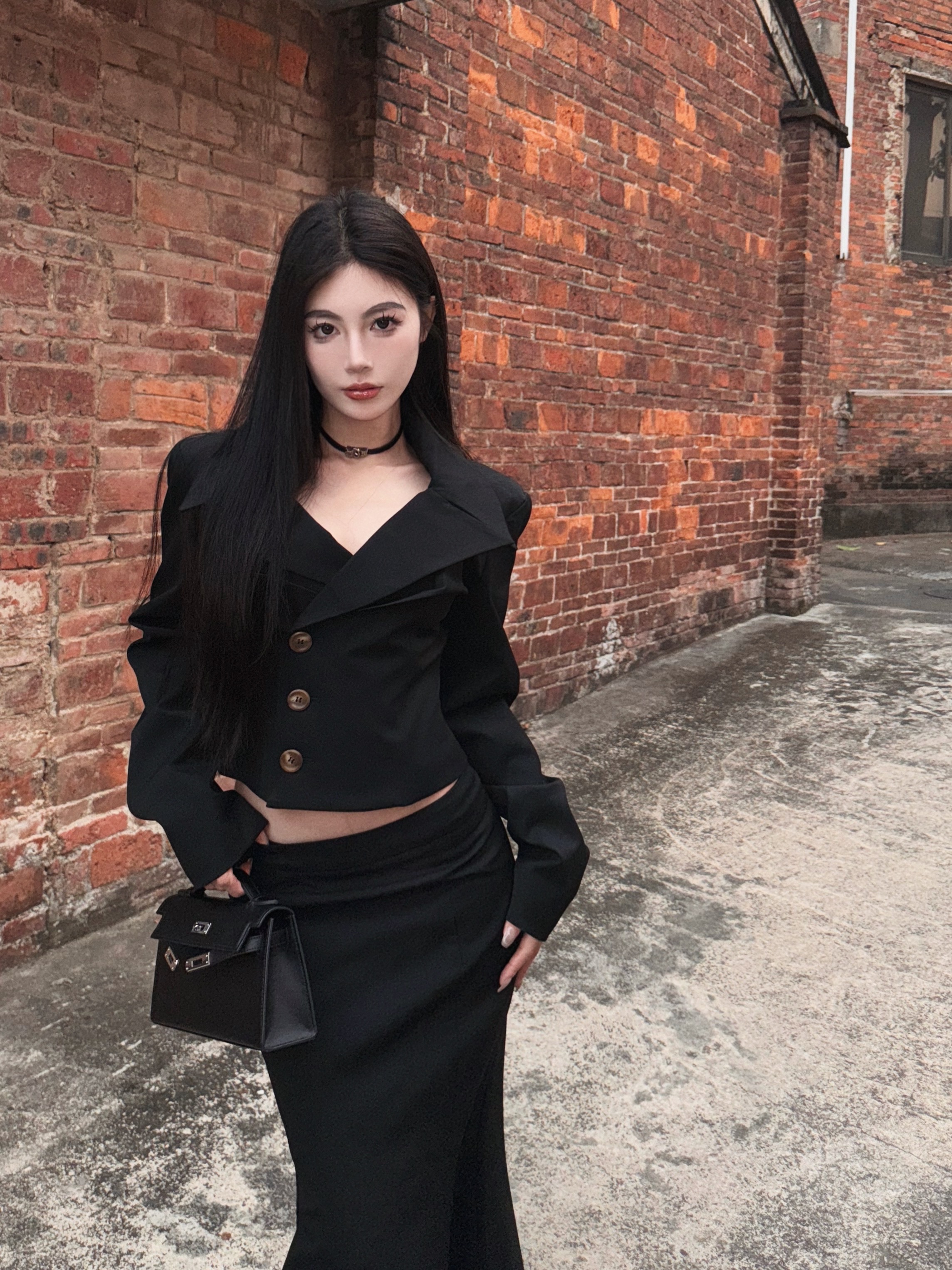 Real shot of urban women's waist-cinching suit, shoulder-padded top, slimming low-waisted fishtail skirt suit