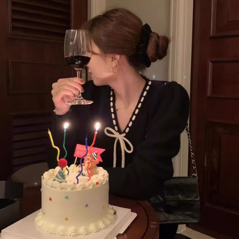 聖誕紅色蝴蝶結毛衣外套女秋冬2023新款設計感v領浣熊絨針織開衫