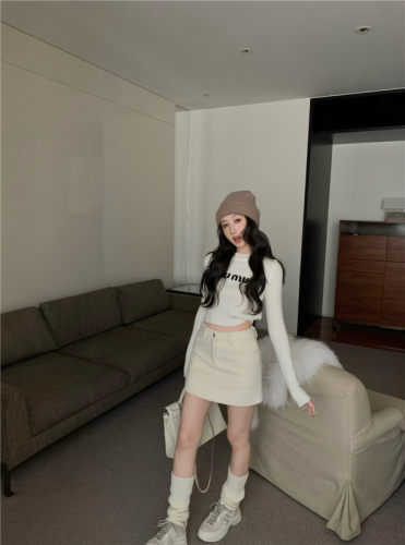 Real shot of round neck pullover short letter sweater with knitted sweater top and woolen skirt suit