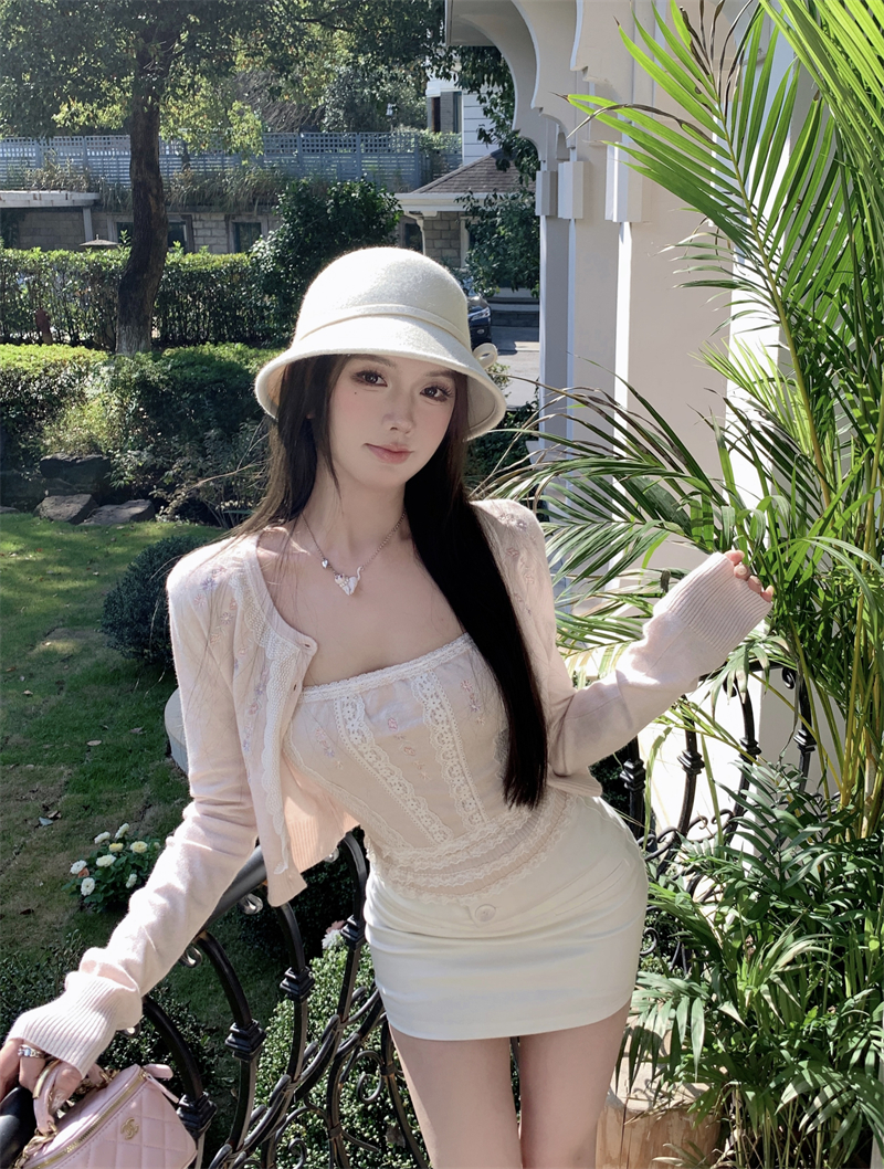 Actual shot of lace knitted cardigan in autumn and winter with delicate floral suspender top