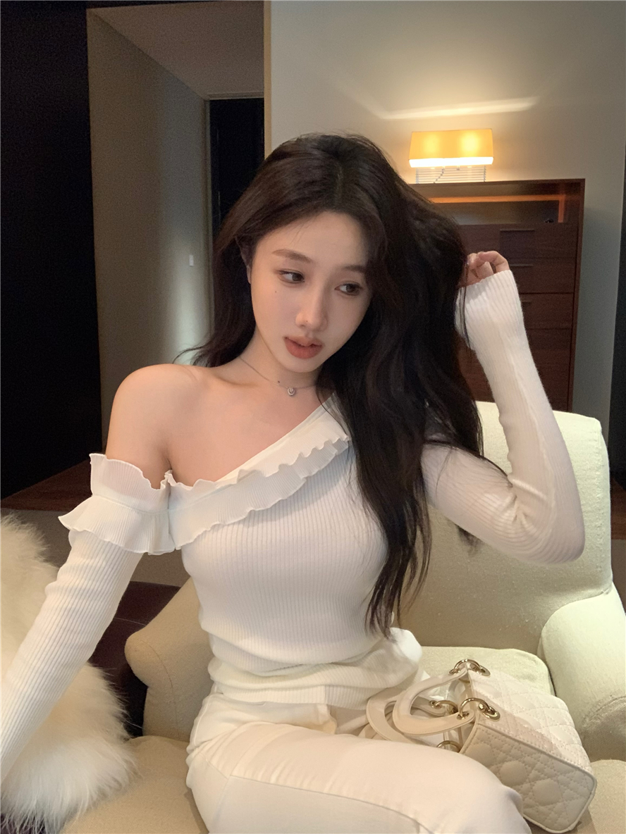 Real shot of heavy-duty lace knitted sweater top with sloping shoulders and sexy inner wear