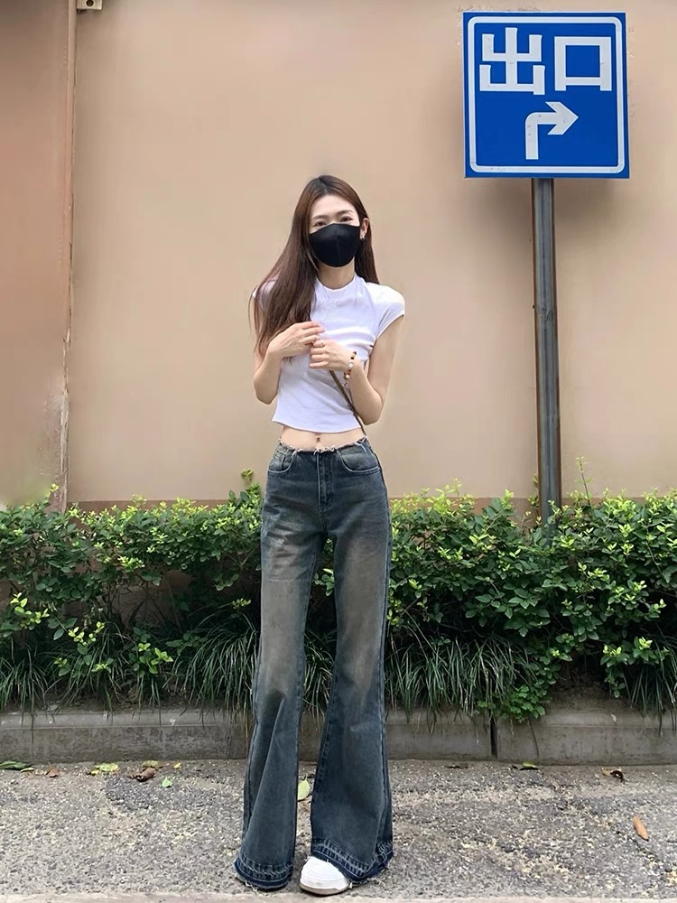 美式復古低腰微喇牛仔褲女2024春季新款設計感毛邊顯瘦直筒闊腿褲